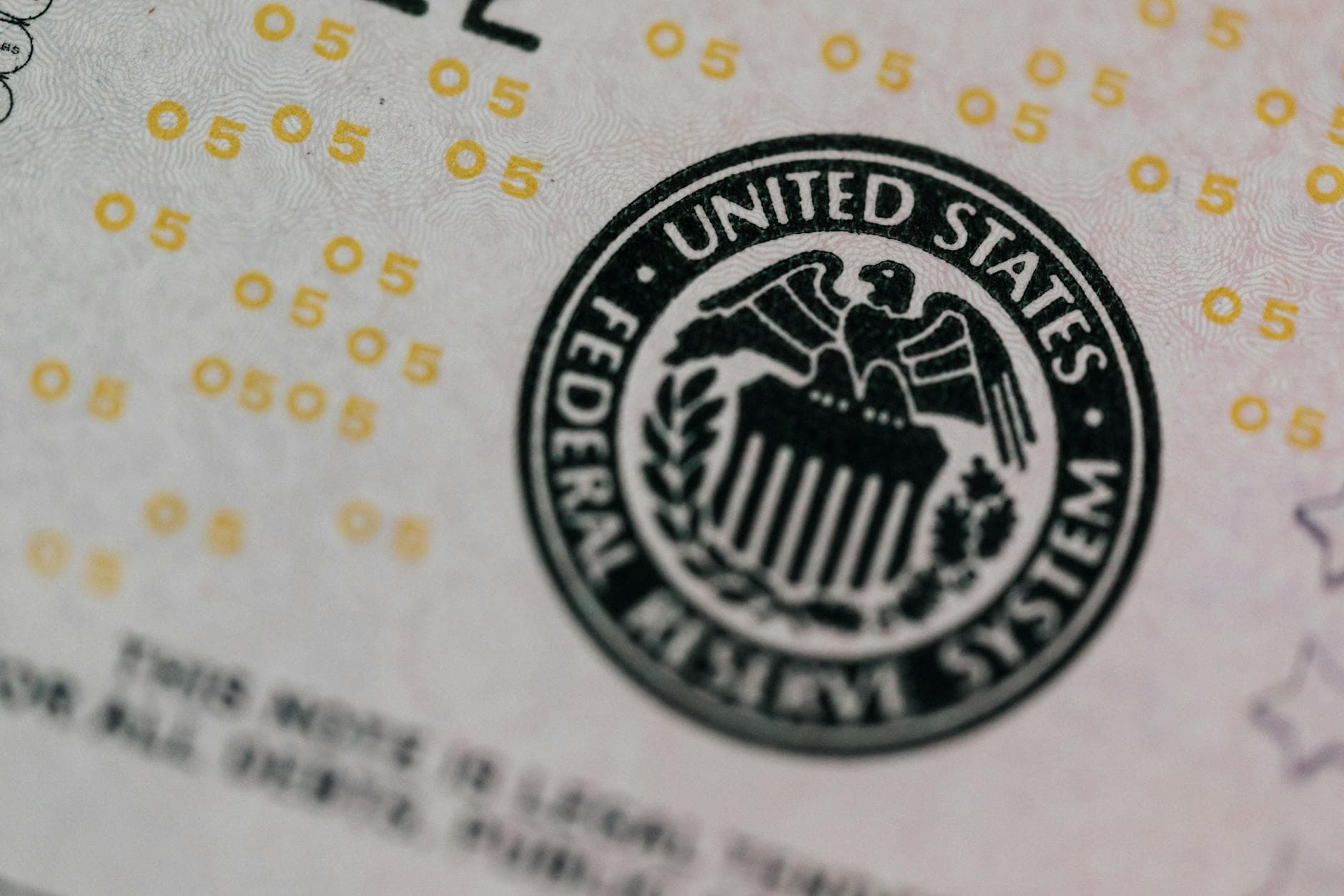 From above eagle on antique column in circle on banknote of Unites States placed on table