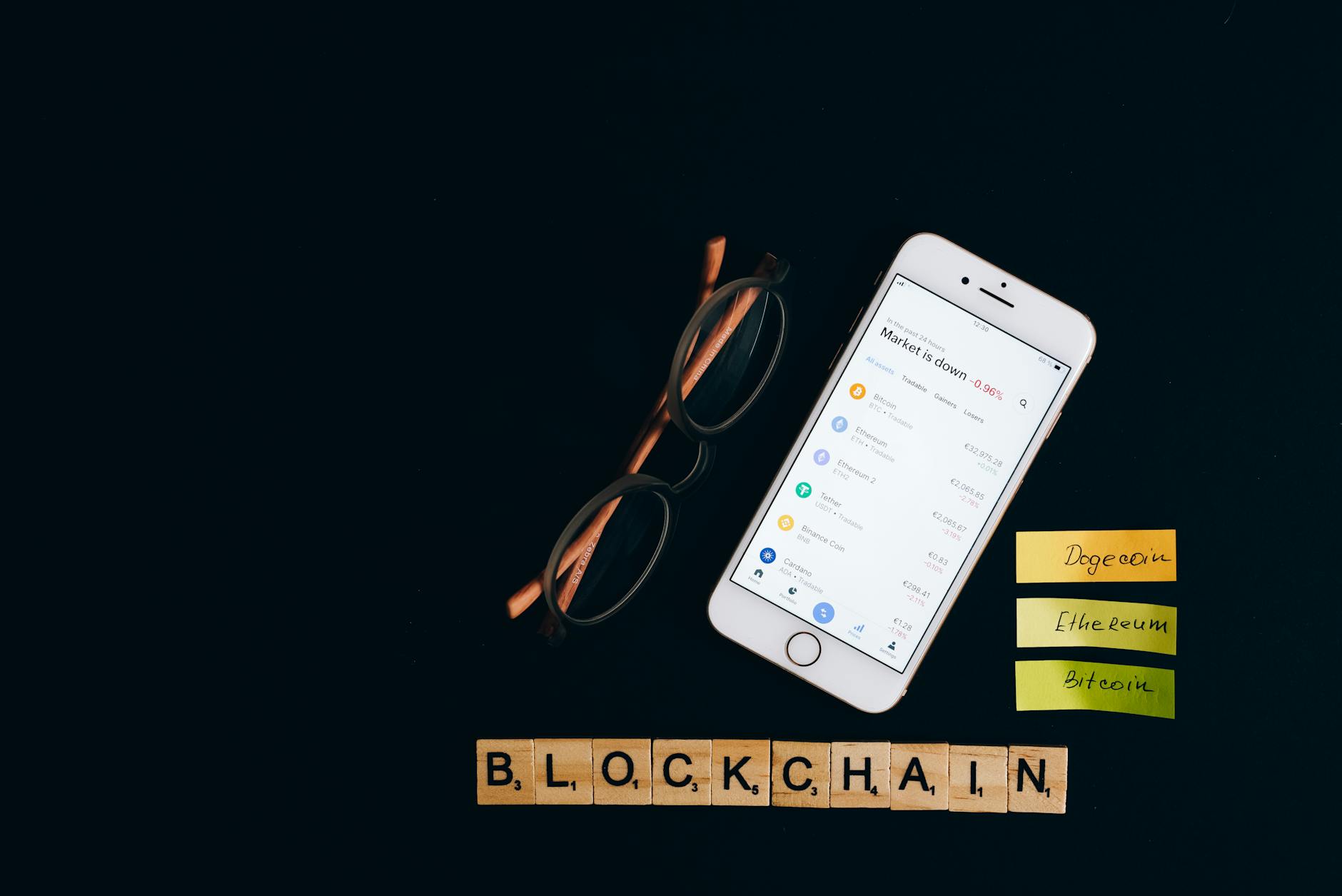 Smartphone displaying cryptocurrency market status with blockchain concept on black backdrop.